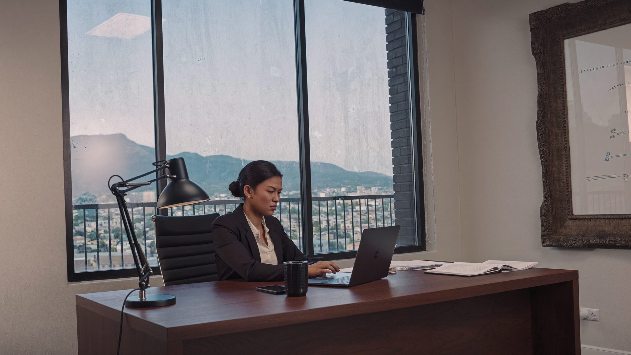 A financial adviser's desk in a Cape Town office, with documents and a calculator